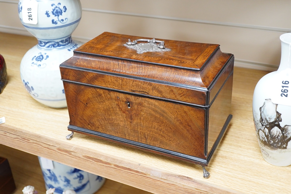 A George III and later flame mahogany veneered writing box raised on ball feet, 30cm wide